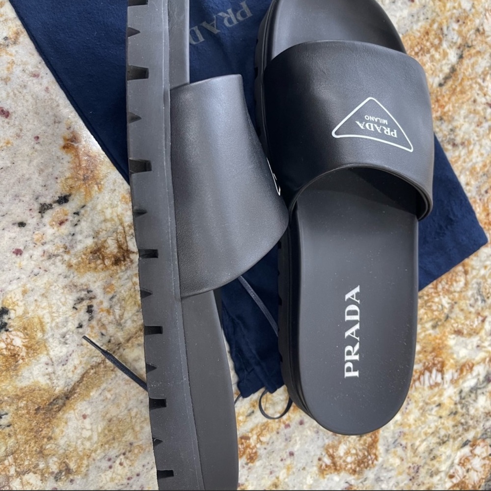 Prada: Lug-Sole Leather Slides